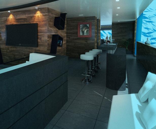Ein modern gestalteter Wohnraum mit Barhockern und einem Aquarium an der Wand.