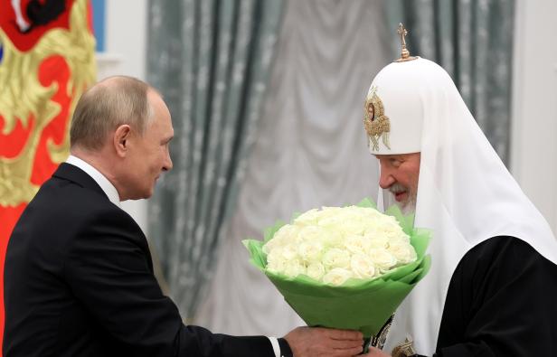 Russian President Vladimir Putin and Patriarch Kirill of Moscow and All Russia attend a ceremony in Moscow