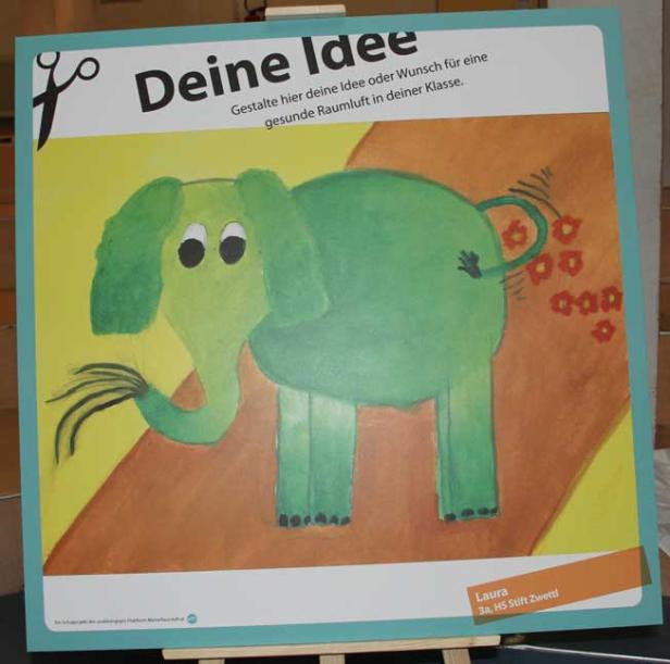 Ein grüner, gemalter Elefant ist auf einem Plakat mit dem Titel „Deine Idee“ abgebildet.