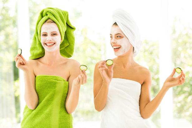 Women with facial masks and cucumber slices