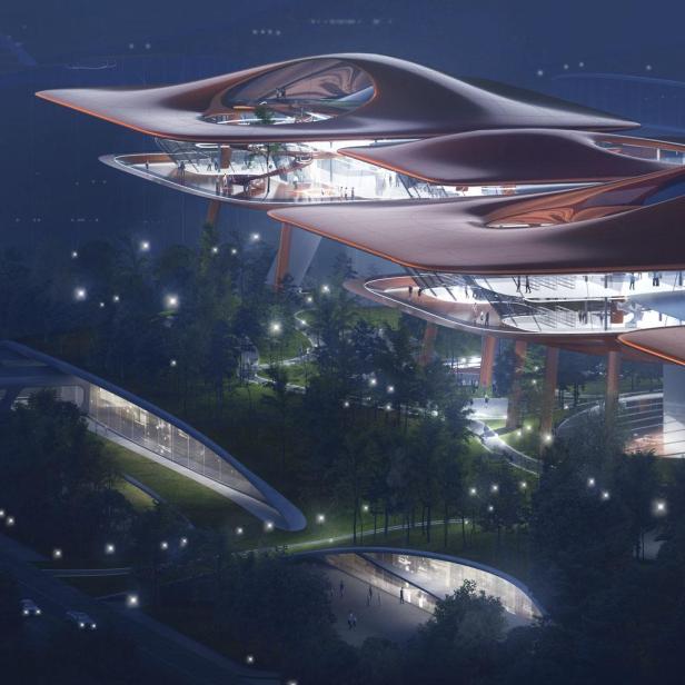 Das Chongqing Cuntan Cruise Terminal bei Nacht mit futuristischer Architektur.