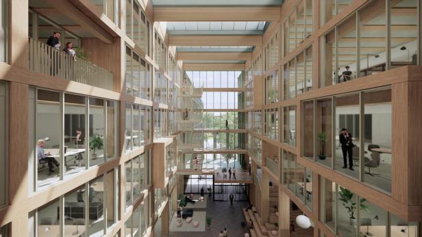 Innenansicht des iCampus im Werksviertel mit Büros und Personen.