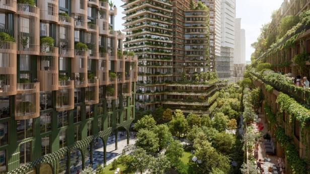 Mehrere begrünte Hochhäuser mit viel Vegetation in einem städtischen Gebiet.
