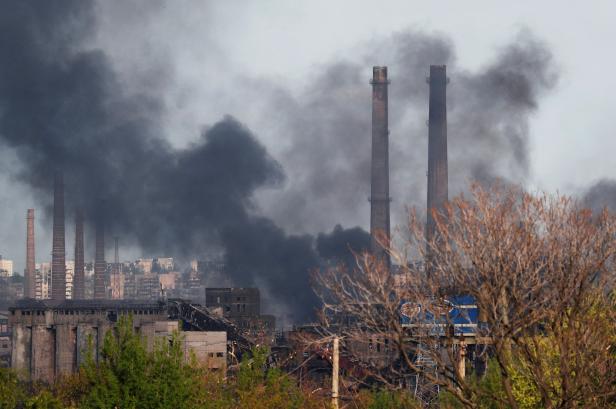 Smoke rises above a plant of Azovstal Iron and Steel Works in Mariupol