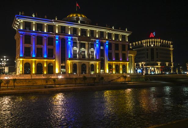 A building of North Macedonia's Ministry of Foreign Affairs  illuminated with the colors of the Ukrainian flag