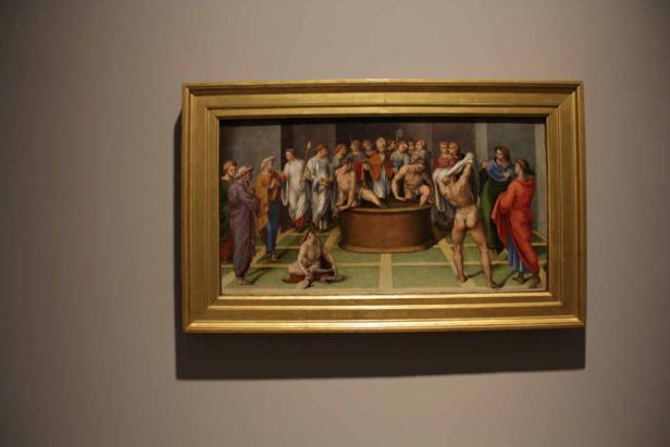 Ein Gemälde, das eine Badeszene mit mehreren Personen darstellt.