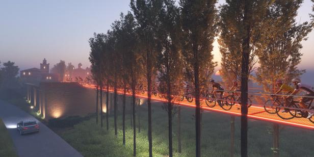 Eine Gruppe von Radfahrern fährt auf einer beleuchteten Brücke, gesäumt von Bäumen.