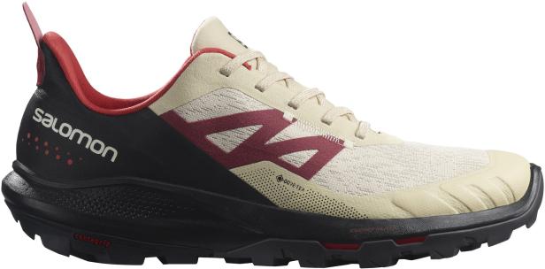 Ein Salomon Laufschuh mit Gore-Tex Membran in Beige, Schwarz und Rot.