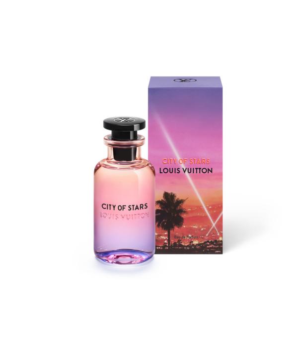 Eine Flasche „City of Stars“ Parfüm von Louis Vuitton neben der zugehörigen Verpackung.