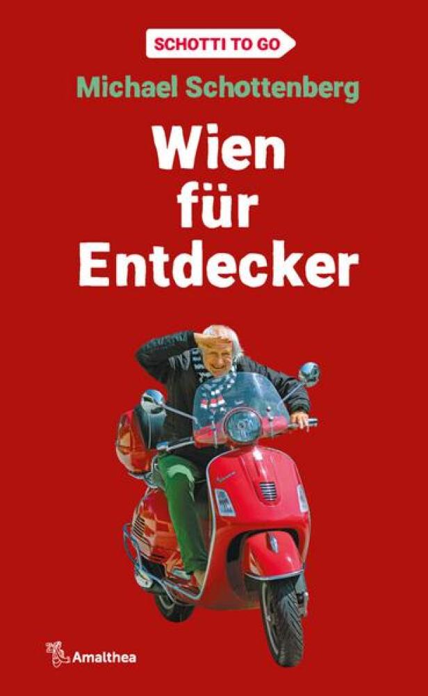 Das Buch „Wien für Entdecker“ von Michael Schottenberg mit dem Autor auf einem roten Motorroller.