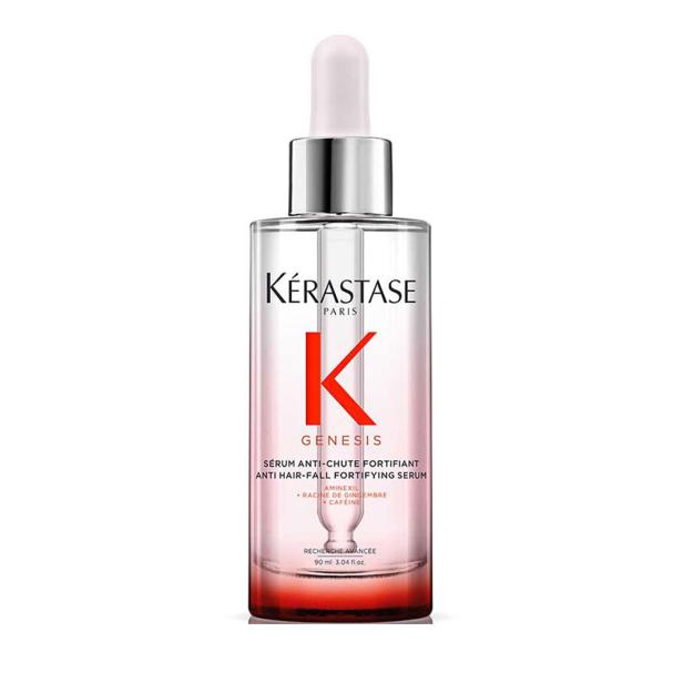 Eine Flasche Kérastase Genesis Serum gegen Haarausfall mit Pipette.
