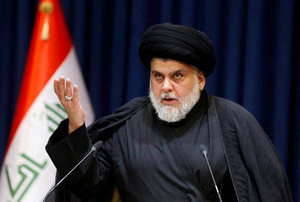 FILE PHOTO: Iraqi populist leader Muqtada al-Sadr delivers a televised speech in Najaf FILE PHOTO: Iraqi populist leader Muqtada al-Sadr delivers a televised speech in Najaf