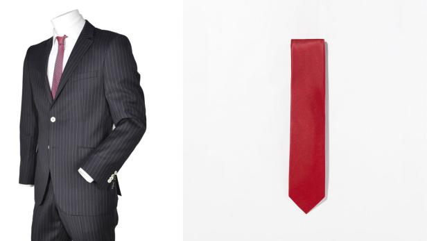 Ein Nadelstreifenanzug und eine rote Krawatte vor einem weißen Hintergrund.