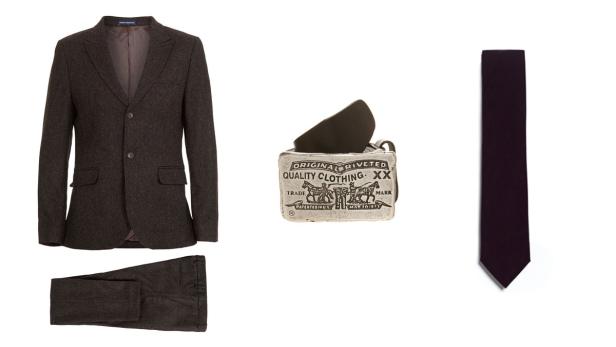Ein brauner Tweed-Anzug, ein Gürtel mit Levi's-Schnalle und eine dunkle Krawatte auf weißem Grund.
