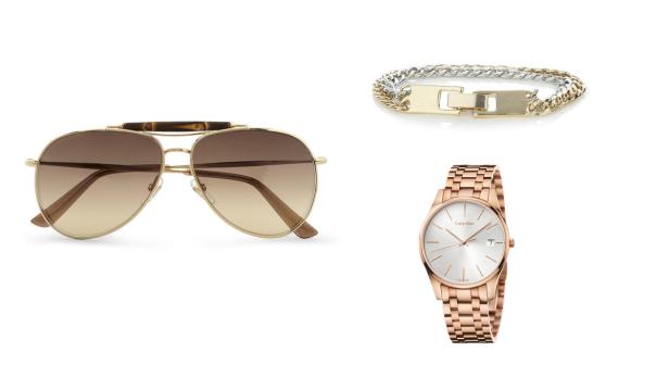 Eine goldene Gucci-Sonnenbrille, ein silber-goldenes Armband und eine roségoldene Calvin Klein-Uhr.