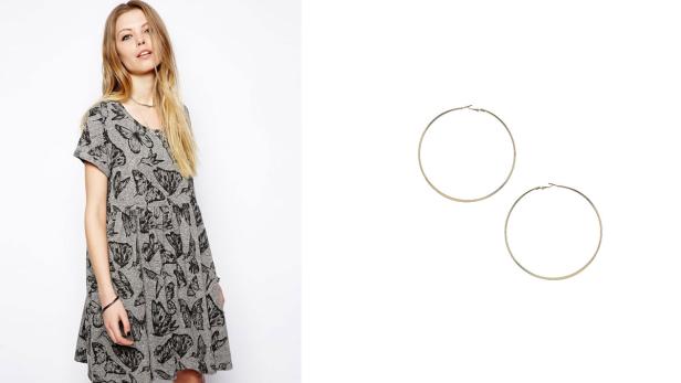 Eine Frau in einem Kleid mit Schmetterlingsmuster und ein Paar goldene Creolen.