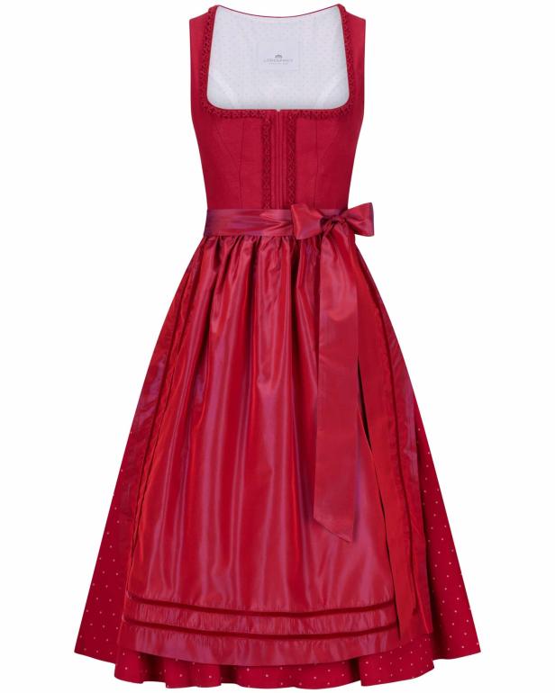 Ein rotes Dirndl mit weiß gepunktetem Unterrock und passender Schürze.