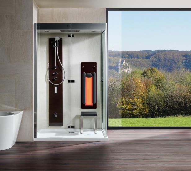 Eine moderne Duschkabine mit Infrarotpaneel und Blick auf eine Landschaft mit Burgruine.