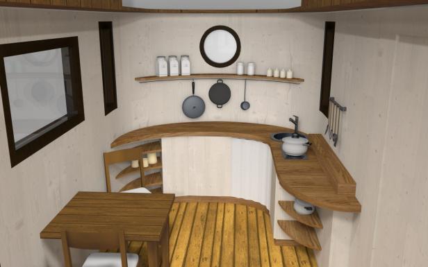 Eine kleine Küche mit Holzboden, Arbeitsflächen und einem Esstisch.