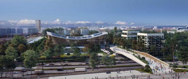 Das Aquatics Centre in Paris mit Fußgängerbrücke und umliegender Bebauung.