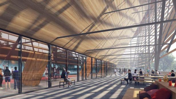 Eine Innenansicht des Centre Aquatique in Paris mit Sportlern und Zuschauern.