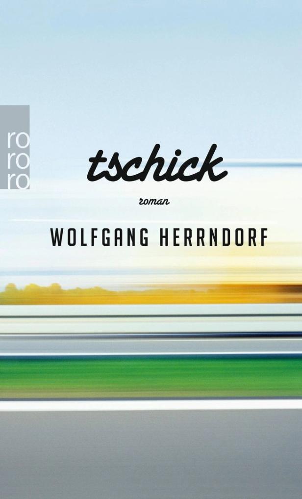 Das Cover des Romans „Tschick“ von Wolfgang Herrndorf zeigt eine verschwommene Landschaft.