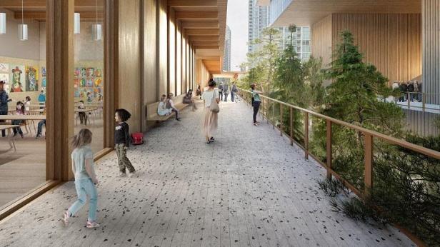 Eine Außenszene der Vancouver Art Gallery mit Menschen auf einem erhöhten Gehweg.