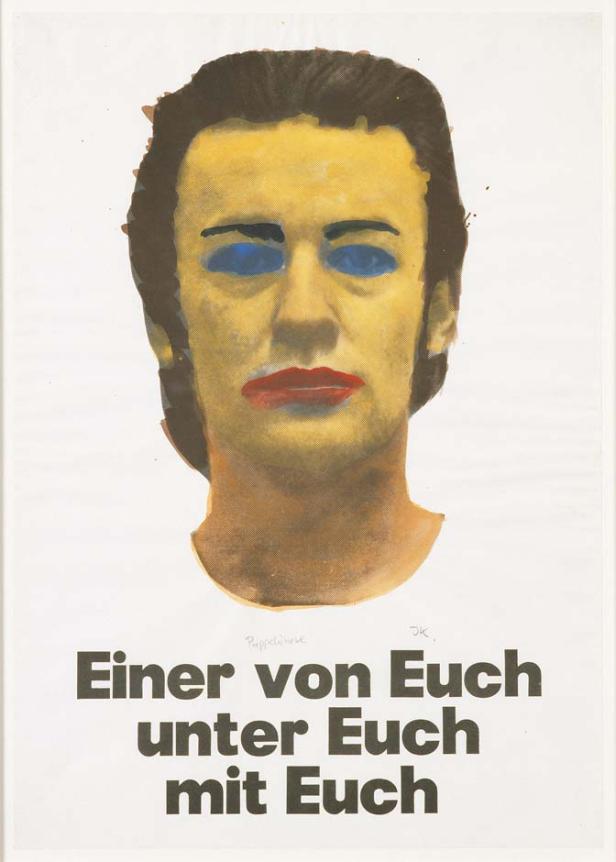 Ein Porträt mit gelbem Gesicht, blauen Augen und rotem Mund über dem Text „Einer von Euch unter Euch mit Euch“.