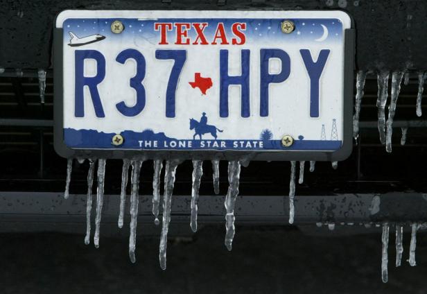 FILE PHOTO: ICE HANGS FROM LICENSE PLATE AFTER WINTER STORM IN DALLAS TEXAS.