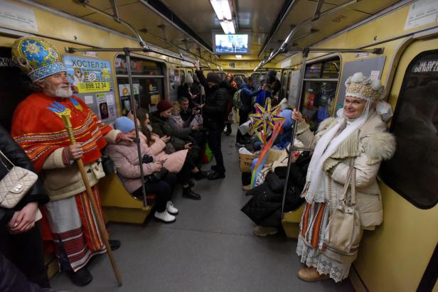 People sing Christmas carols in Kyiv mero station 