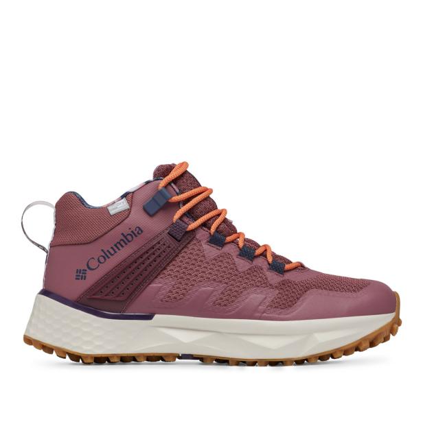Ein Columbia Wanderschuh in Rosa- und Orangetönen mit einer markanten weißen Sohle.