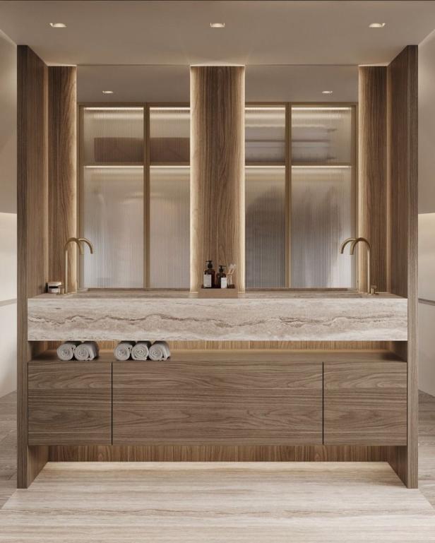 Ein modernes Badezimmer mit Doppelwaschbecken und Holzverkleidung.