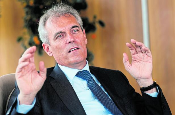 FILE PHOTO: CEO of Austrian energy group OMV Seele gestures during an interview in Vienna, Austria