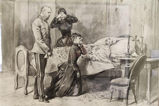 Eine Szene am Sterbebett mit drei trauernden Personen und einem Mann im Bett.