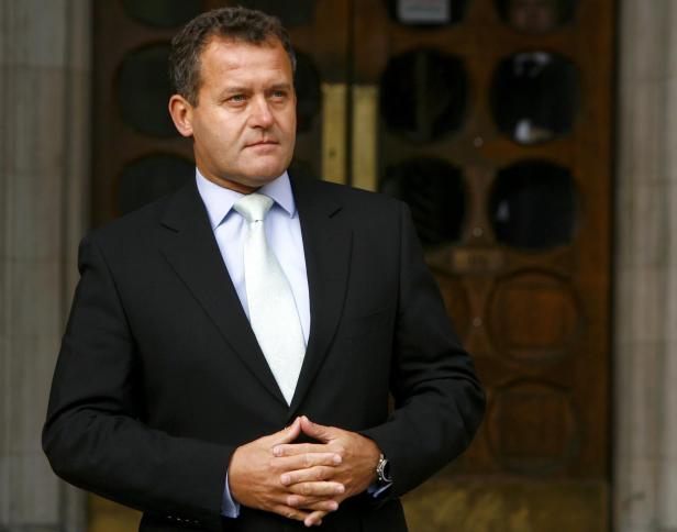 Princess Diana's former butler Paul Burrell poses for photographers at the High Court in London