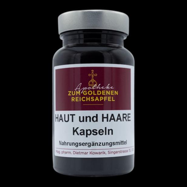 Eine Dose „Haut und Haare“ Kapseln von der Apotheke „Zum goldenen Reichsapfel“.