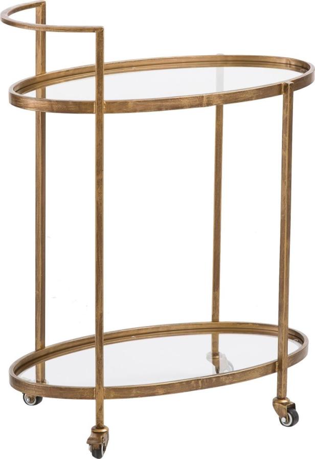 Ein goldfarbener Servierwagen mit ovalen Glasablagen und Rollen.