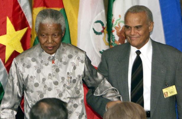 FILE PHOTO: HARRY BELAFONTE ESCORTS NELSON MANDELA AT UNITED NATIONS LUNCHEON.