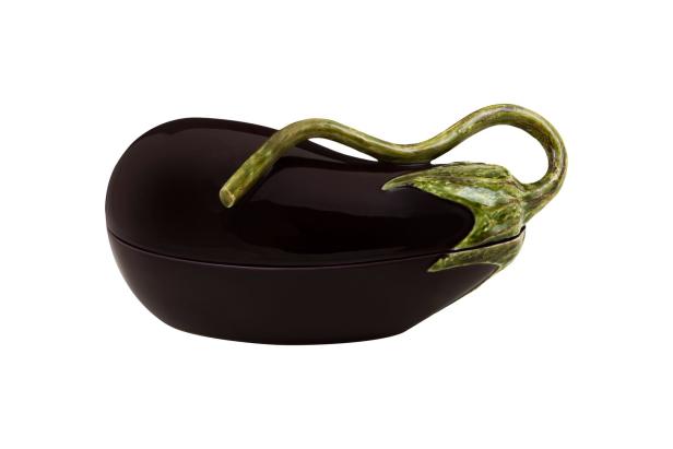 Eine aubergineförmige Keramikdose mit Deckel und grünem Stiel als Griff.
