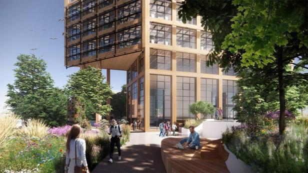 Ein modernes Bürogebäude mit einem begrünten Gartenbereich und Passanten.
