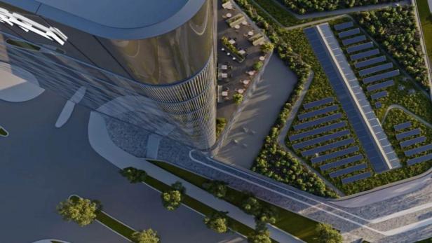 Luftaufnahme des Porsche Design Towers mit Solaranlage und Dachterrasse.