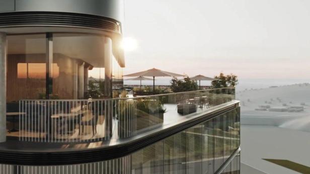 Ein Blick von einem Balkon des Porsche-Design-Towers auf den Strand.