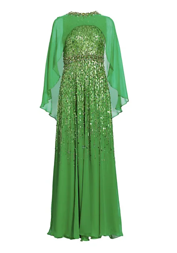 Ein langes, grünes Abendkleid mit Pailletten und einem Cape.