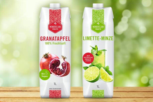 Zwei Getränkekartons von „Wonderland Fruits“: Granatapfel und Limette-Minze.