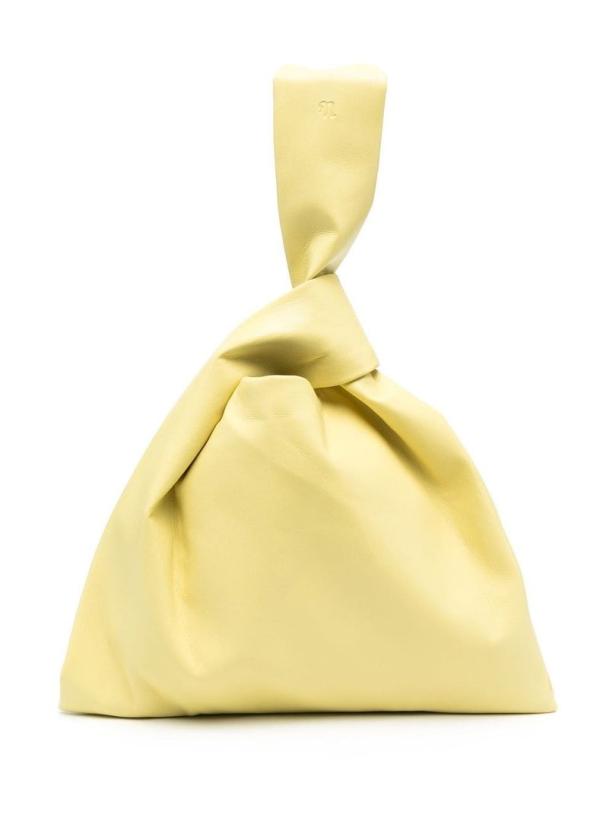 Eine hellgelbe, knotenförmige Handtasche aus Leder vor einem weißen Hintergrund.