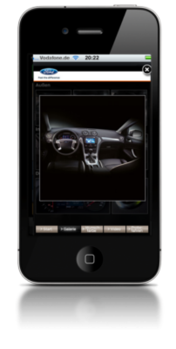 Ford-Kampagne/Wunderman/Mindshare/Yoc/Ad Plus Auf dem Bildschirm eines iPhones ist das Interieur eines Ford-Fahrzeugs zu sehen.