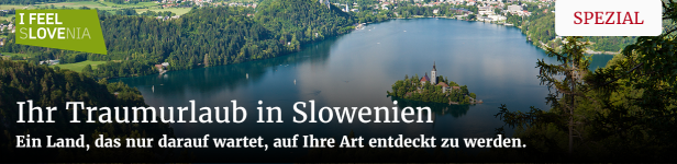 Blick auf den Bleder See mit der Kirche auf der Insel und bewaldeten Ufern.