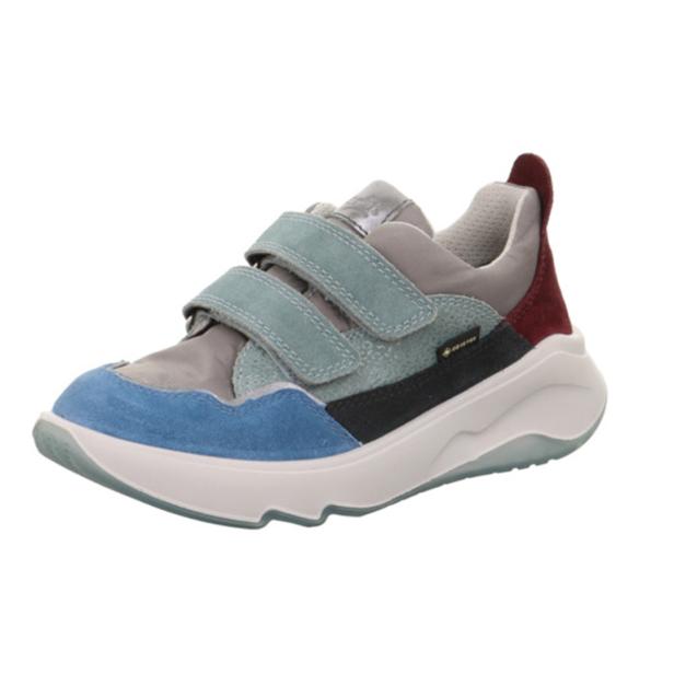 Ein farbenfroher Kinderschuh mit Klettverschluss und dicker, weißer Sohle.