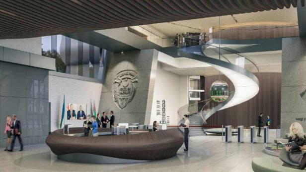 Die Lobby des Finanzministeriums in Baku mit Rezeption, Wendeltreppe und Wappen.