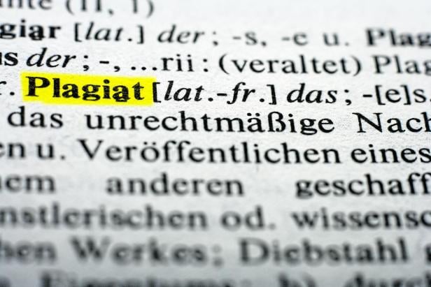 Extreme close up of english dictionary, word plagiat